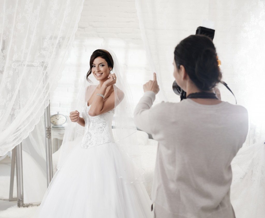 photographer taking photo of a bride