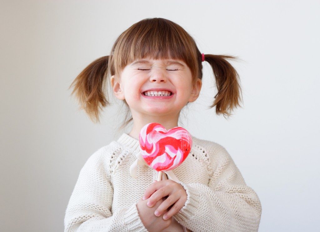 Child holding a lollipop