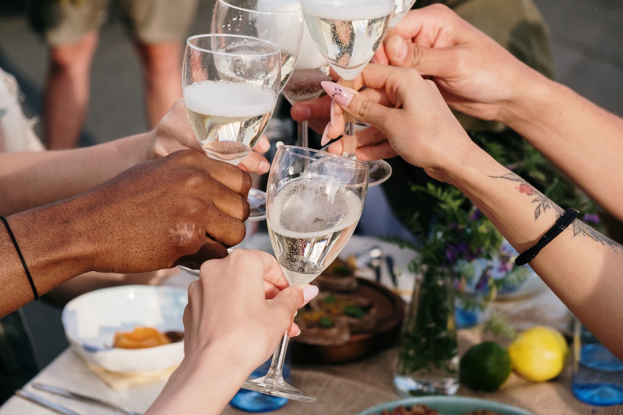 people raising their glasses