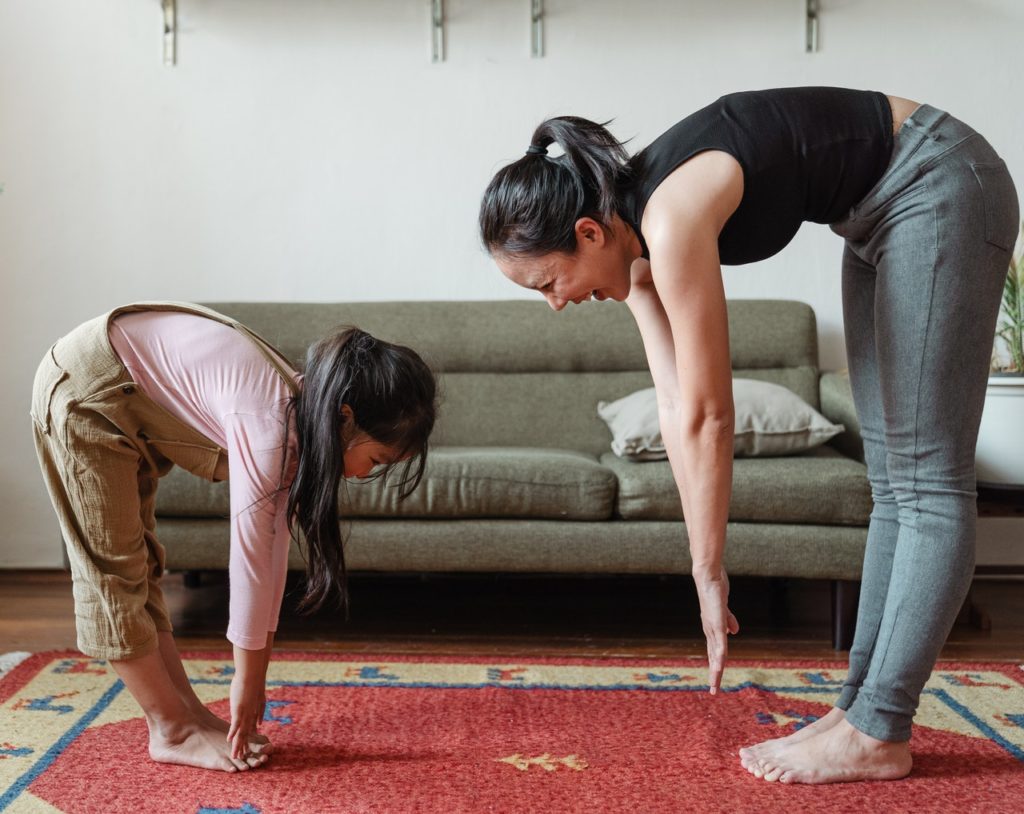 mom and daughter stretching