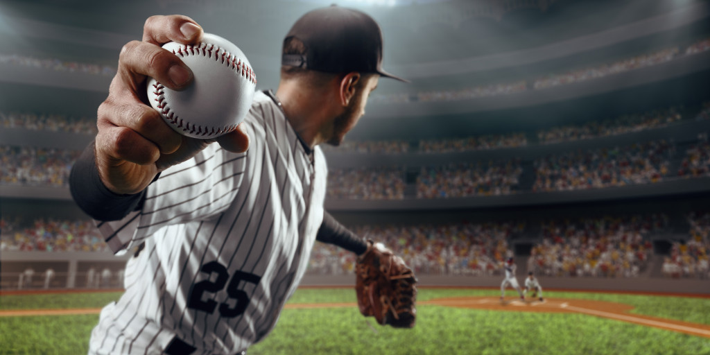 man throwing a pitch in a baseball game