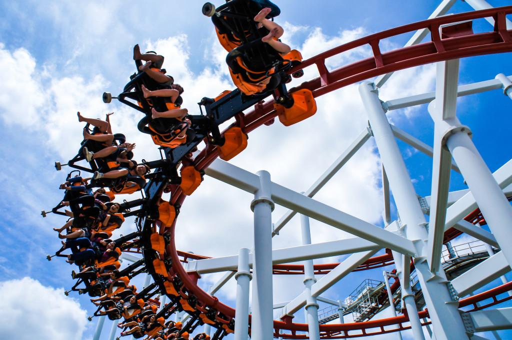 A rollercoaster ride at a theme park on a nice day