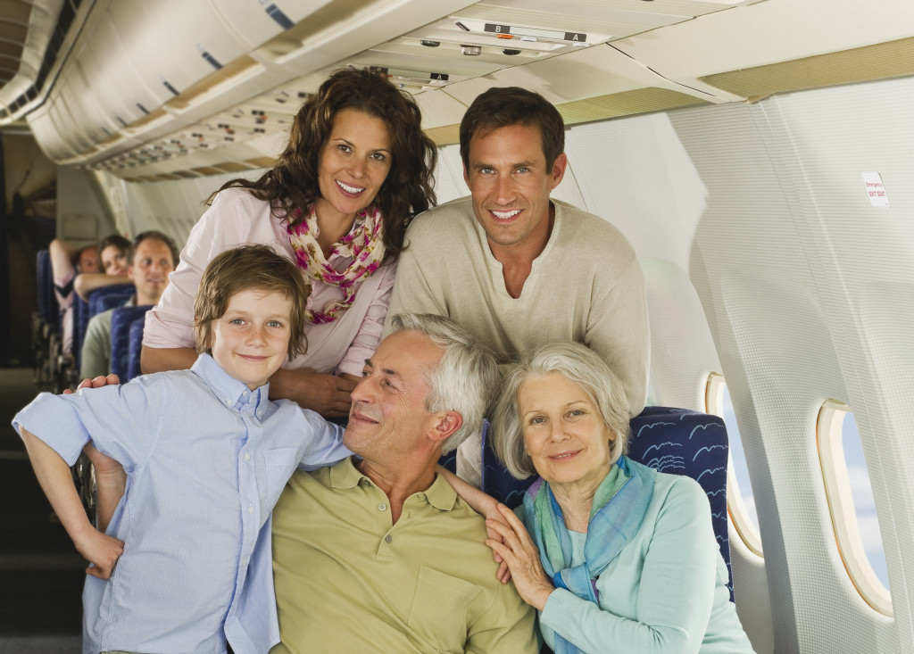 a portrait of a happy family on an airplane