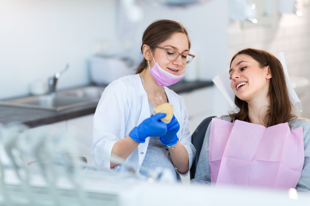 two woman smiling together