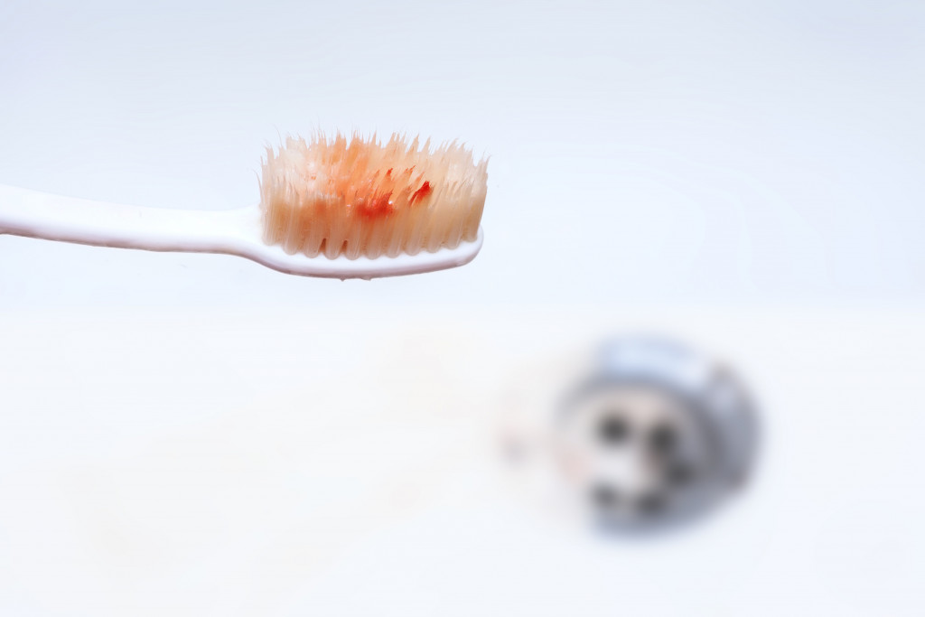 Blood on toothbrush, concept of bleeding gums