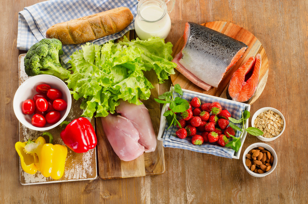 bunch of healthy food and vegetables in wooden table