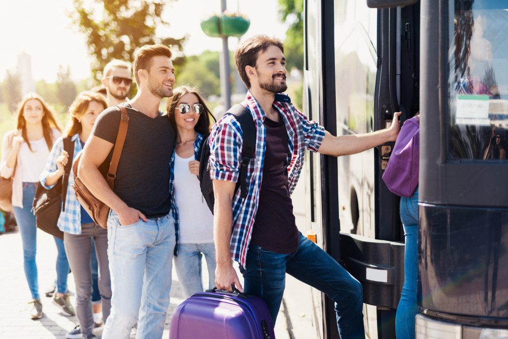 Young people boarding a bus to a new destination.