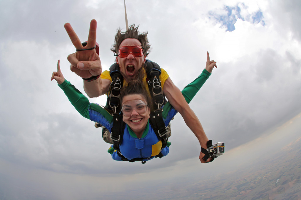 man and woman skydiving and having fun