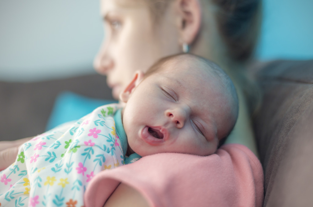 Sleeping baby with mother