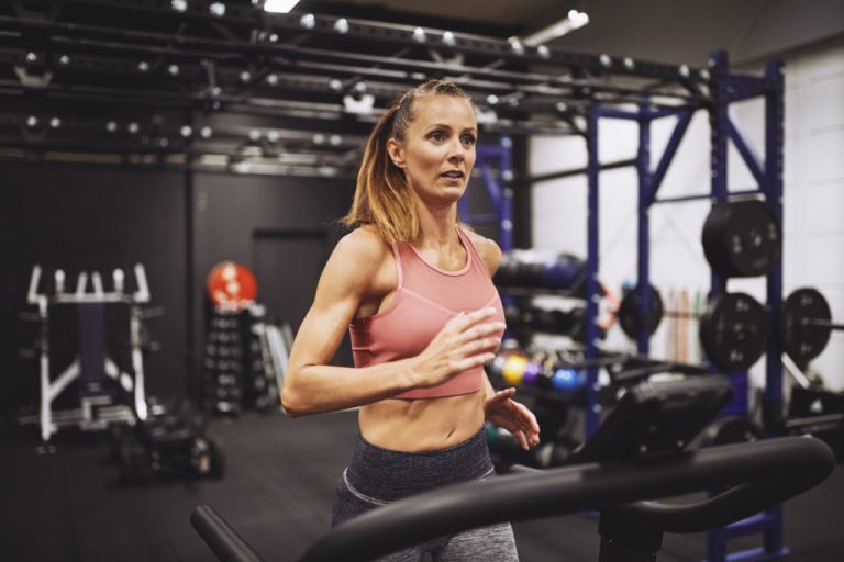 woman in the treadmill exercising