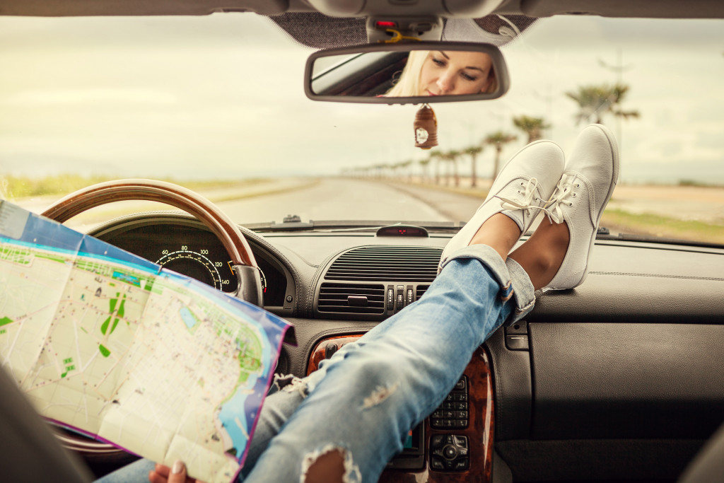 woman in the car planning her route